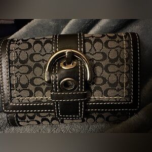 Coach Tri-fold Wallet- 
The wallet is in excellent shape and taken care of.